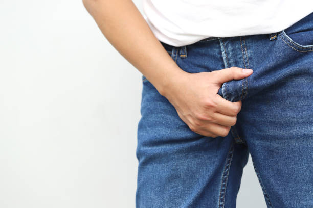 istock man covers groin, health problems disease for premature ejaculation, fertility, erection. The concept of protection of sexually transmitted infections. prostate problem testicular cancer. 2155684942