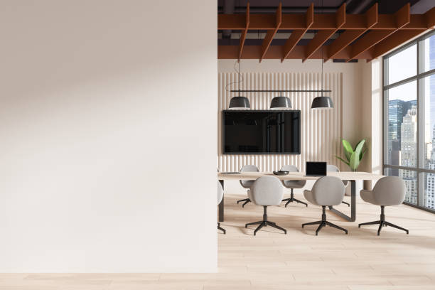 istock Beige conference interior with table and chairs, tv and window. Mockup wall 2155685429