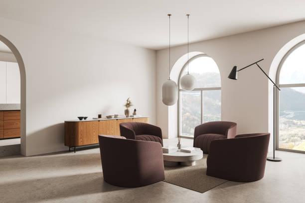 istock Stylish living room interior with armchairs and sideboard, panoramic window 2155685544