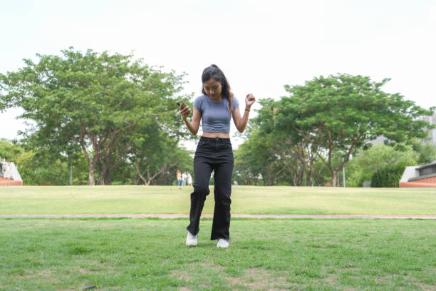 istock Young Thai woman dancing outdoors 2155694221