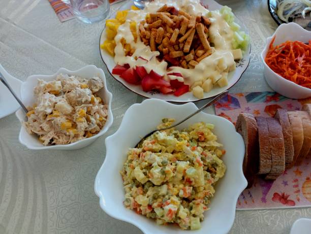 istock Many different dishes on the table. Salads and other dishes on the festive table. A large selection of delicious dishes. 2155694765