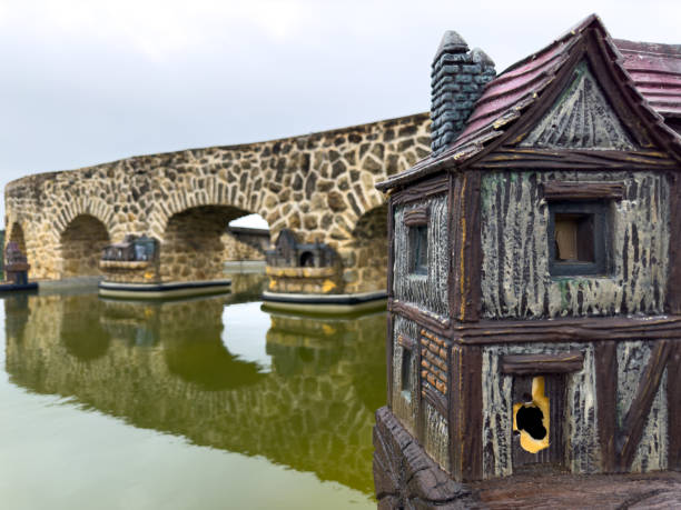 House by mirror lake with stone bridge