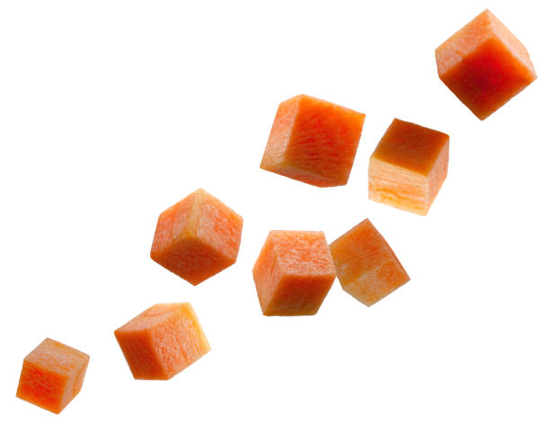istock Carrot cubes fly in space forming a chain shape. Volumetric back light. Isolated on white 2155698068