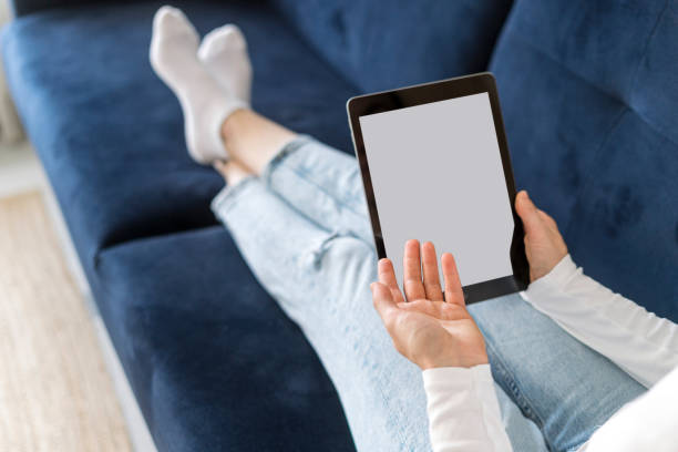 istock Woman hold digital tablet with empty display in hands, talking on video call 2155700261
