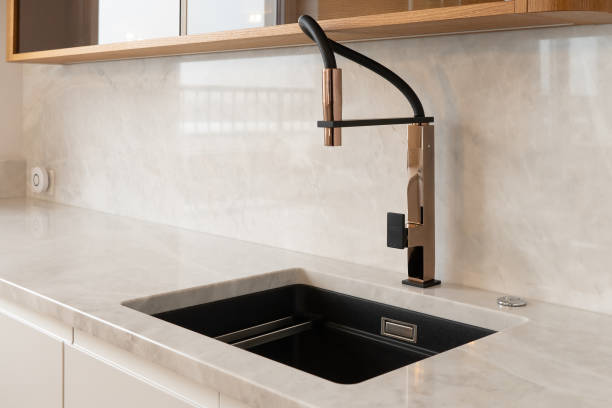 istock Modern Kitchen Faucet with Marble Countertop and Sink 2155701673