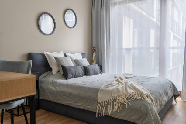 istock Cozy Modern Bedroom with Soft Lighting and Elegant Decor 2155701683