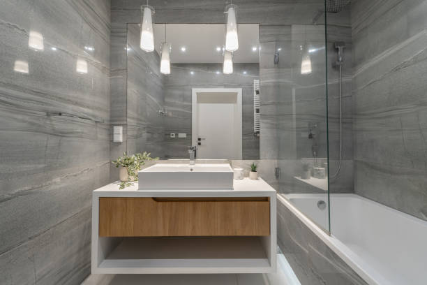istock Sleek Modern Bathroom with Elegant Fixtures and Large Mirror 2155701701