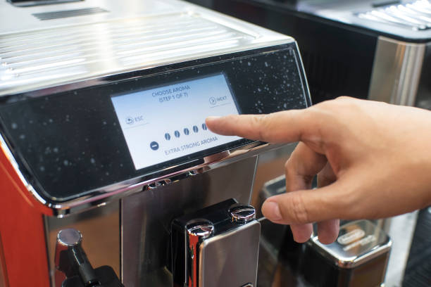 istock A barista operating a touchscreen coffeemaker, choosing the aroma strength. 2155706167
