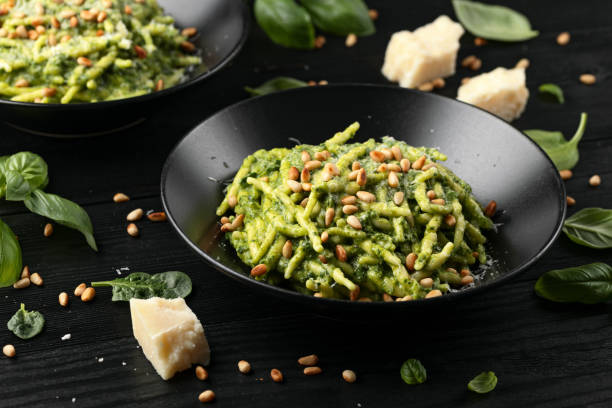 istock Trofie pasta with creamy spinach sauce and toasted pine nuts 2155706194