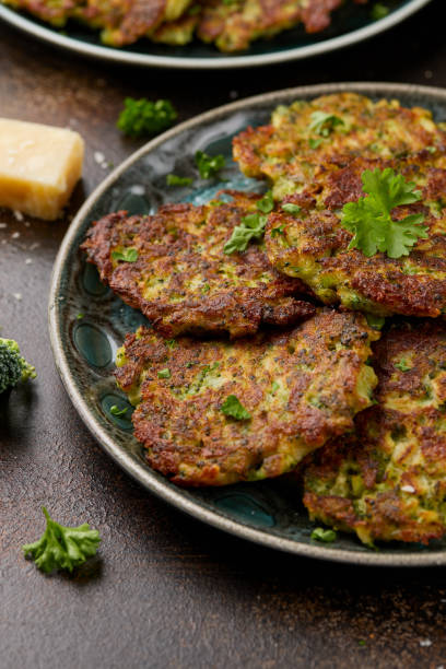 istock Fried Broccoli fritters or pancakes with parmesan and mozzarella cheese 2155706419