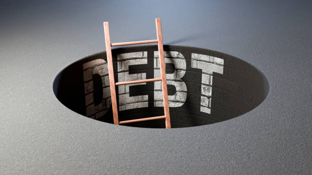 istock Hole in floor with DEBT spelled out along the side wall. 2155707745