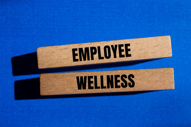 istock Employee wellness words written on wooden blocks with blue background 2155709371