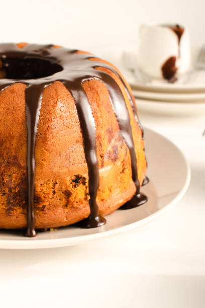istock Chocolate Marble Bundt Cake with chocolate glaze drizzled on a plate 2155713549