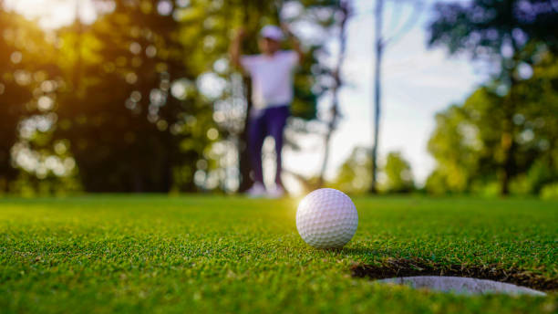 istock Blurred golfer playing golf in the evening golf course, on sun set evening time. 2155719084