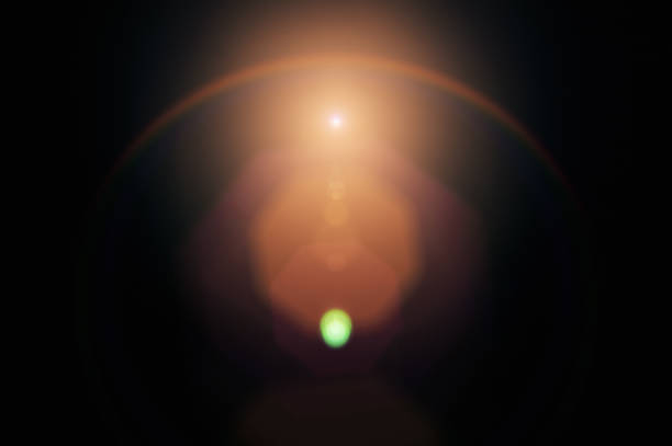 lens flare on black background. overlay design element - luz imagens e fotografias de stock