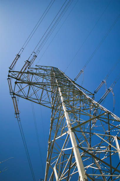 istock Blue sky and high voltage tower seen from below 2155723109