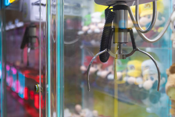 istock A claw machine with a pink stuffed animal in the middle 2155723580