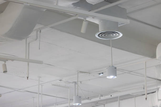 istock A white ceiling with a series of vents and lights 2155723584