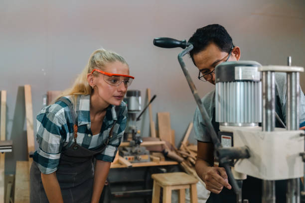 istock professional artisan carpenters woodworking team work together creatively, creative carpenter woman working workshop for wooden craft with wood tool at industry carpenter's shop, business of wood 2155727393
