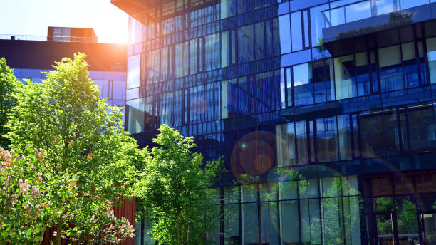 istock Sustainable glass office building with trees for reducing carbon dioxide. 2155727889