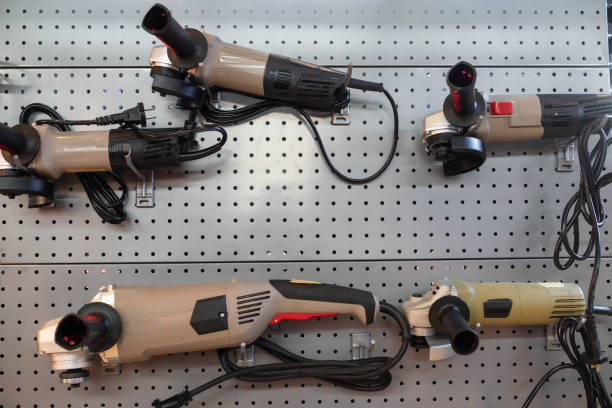istock A collection of electric grinders hanging on a perforated wall display at a hardware store, showcasing different models and designs. 2155728049