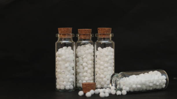 istock Homeopathy medicines. Bottles and pills. 2155728787