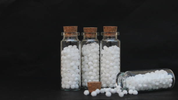 istock Homeopathy medicines. Bottles and pills. 2155728794