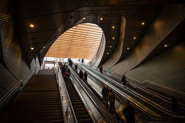 Germany, Berlin, Berlin Hauptbahnhof, February 20, 2025 - High angle view of people on a escalator