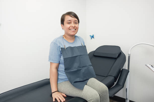 istock Young Mexican female client at Tooth whitening salon 2155732398