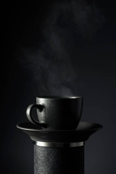 istock Black cup of coffee on a black background. 2155734929