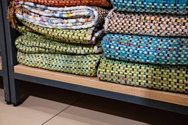 istock A woven rug made of old things. Eco-friendly development. Reuse of items. Handmade work. 2155735817
