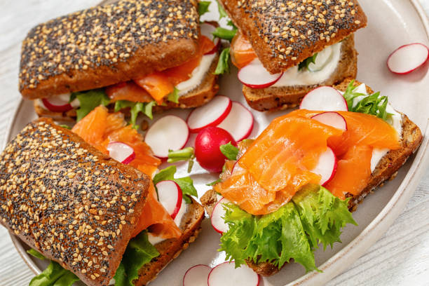 istock smoked salmon sandwiches on rye bread rolls 2155735873