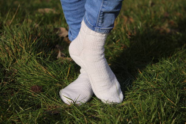 istock A person's feet in the grass 2155736579
