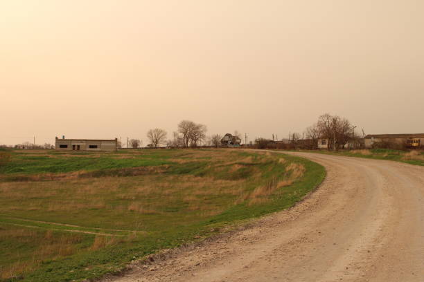 istock A dirt road leading to a farm 2155737392