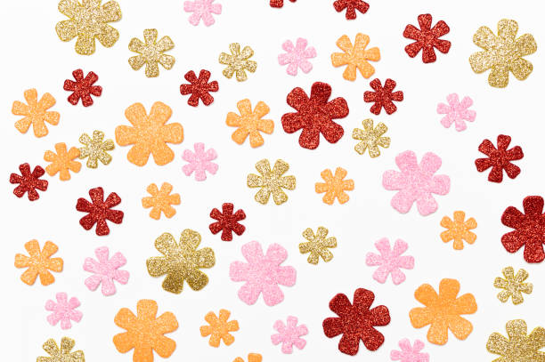 Colorful glittered flowers on a white background
