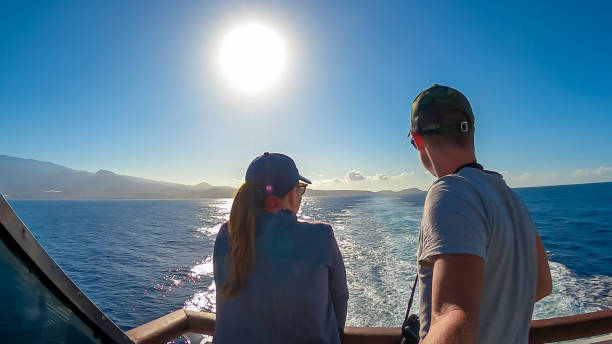 San Sebastian - Man enjoying the panoramic view from the ferry on the port of San Sebastian de La Gomera Tourist couple taking selfies on the ferry between San Sebastian de La Gomera and Los Cristianos. Panoramic view from the ferry on the Tenerife. Canary Islands, Spain, Europe. Spring and summer yacht selfie stock pictures, royalty-free photos & images