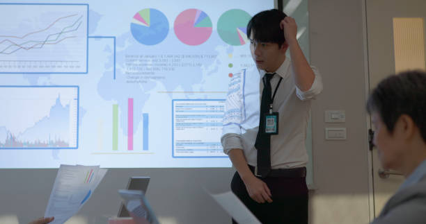 istock businessman do presentation in boardroom 2155743938