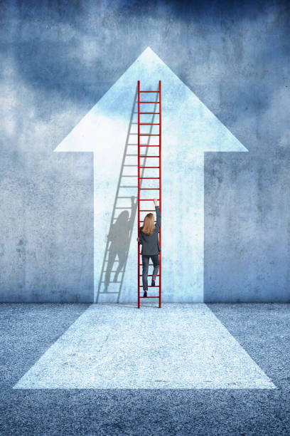 istock Businesswoman Climbing Ladder 2155744512