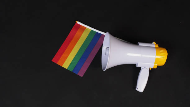 istock Pride flag and megaphone on black background 2155745711