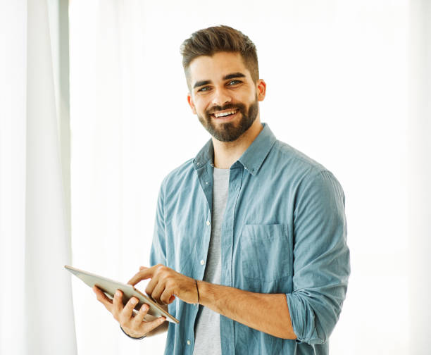 istock portrait man tablet technology male computer young happy lifestyle handsome smiling digital internet online 2155745722