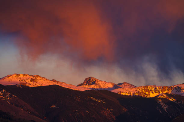 Mount of the Holy Cross with Alpenglow Light - Iconic 14er mountain near Vail and Beaver Creek, Colorado illuminated with warm dramatic alpenglow light. Scenic snowcapped mountain landscape incorporating the Holy Cross Wilderness Area.