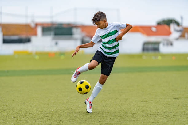 Teenage boy playing soccer
