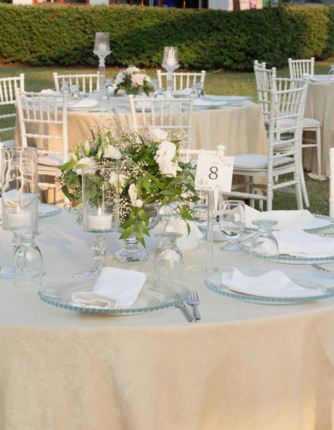 istock Wedding table decoration with fresh colorful flowers, plates and candles 2155753390