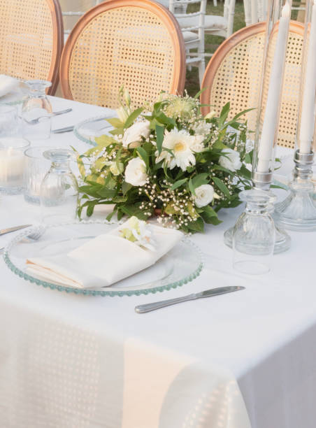 istock Wedding table decoration with fresh colorful flowers, plates and candles 2155753468