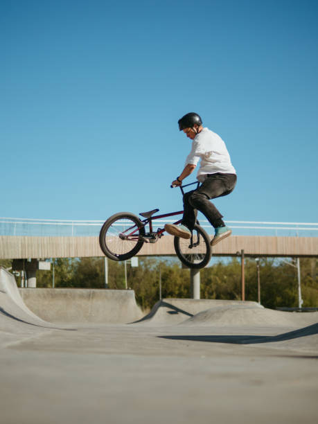 istock BMX bicycle rider making trick Bunny Hop Tailwhip Flat 2155755216