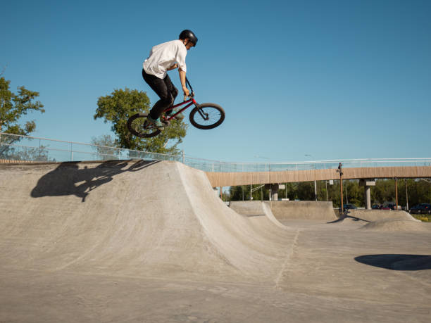 istock BMX bicycle rider performing aerial trick 2155755395
