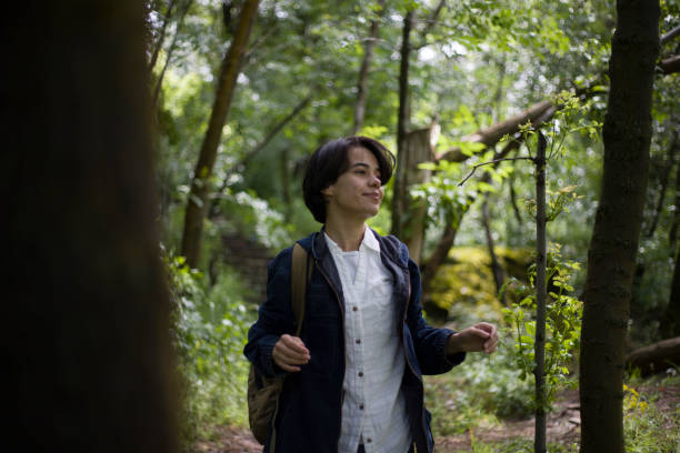 istock young lady with short hair spending time in the park 2155756300