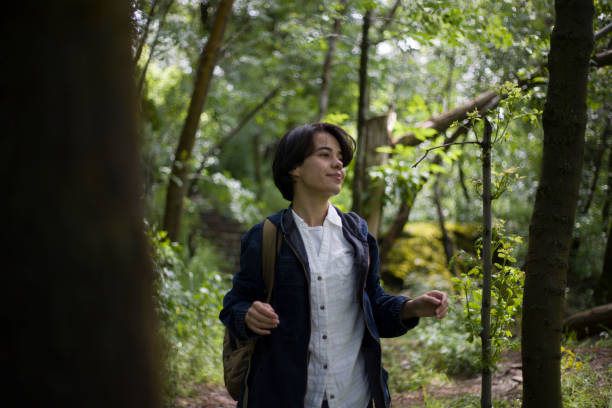 istock young lady with short hair spending time in the park 2155756321
