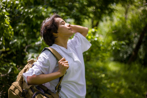 istock young lady with short hair spending time in the park 2155756685