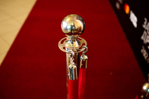 istock Red carpet with rope barriers 2155757035